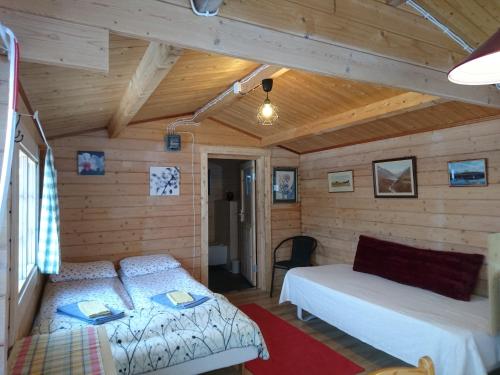 A bed or beds in a room at Stora Sandfell Rooms and Cottages