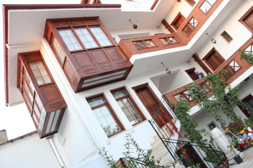 an aerial view of a building with wooden doors and windows at Hotel Mary's House in Selcuk