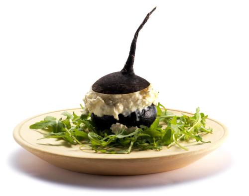 a dessert on a plate with a spoon at Pension Lectar in Radovljica