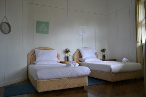 En eller flere senge i et værelse på Mesilau Mountain Retreats