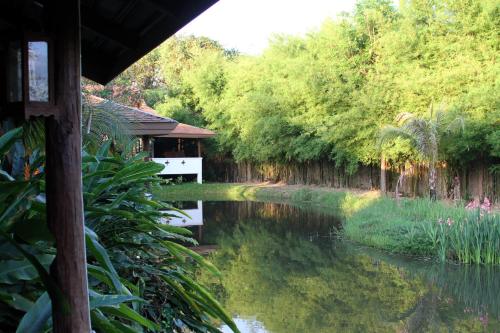 a view of a river from a house at Jasmine Hills Lodge in Doi Saket