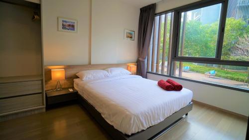 Postel nebo postele na pokoji v ubytování 23° Khao Yai