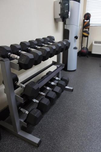 a row of dumbbells in a gym at Baymont by Wyndham Saraland in Saraland