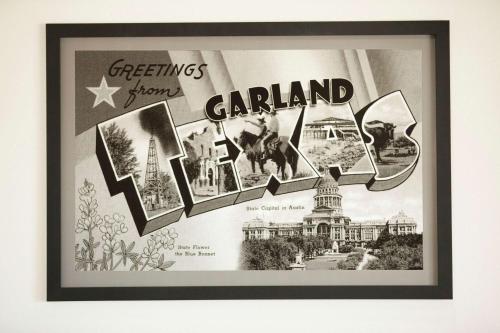 a framed picture of a parkland sign on a wall at Super 8 by Wyndham Garland Rowlett East Dallas Area in Garland