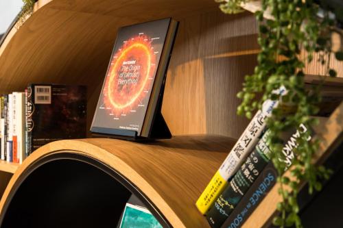 a book sitting on top of a table with books at HOTEL THE FLAG Shinsaibashi in Osaka
