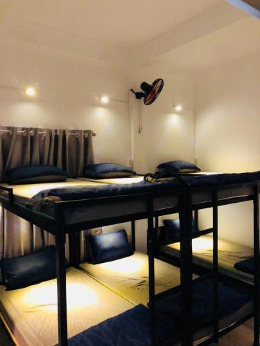 Postel nebo postele na pokoji v ubytování Friendly House Homestay