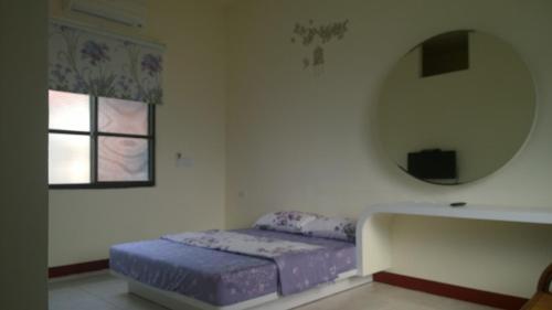 Кровать или кровати в номере Da Peng Bay Homestay