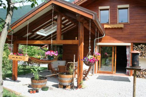 a house with potted plants in front of it at Chambre d'hôtes "LES CRETS" in Mercury