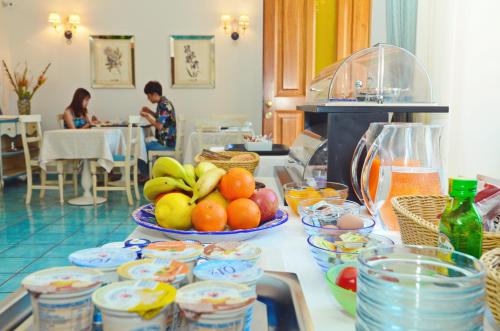 a counter with bowls of fruit on a table at Villa Maria in Amalfi