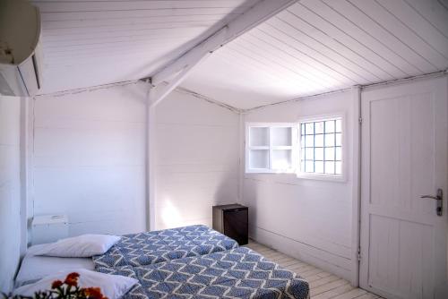 Paradise Beach Camping tesisinde bir odada yatak veya yataklar