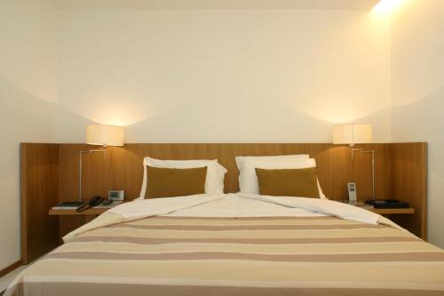 Кровать или кровати в номере Rota Suites