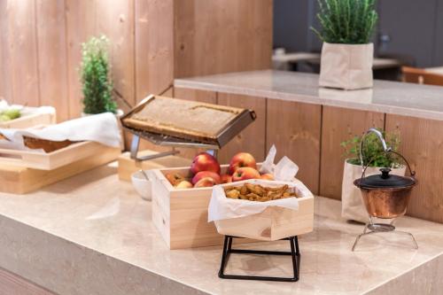 a bunch of boxes of apples on a counter at Rikli Balance Hotel – Sava Hotels & Resorts in Bled