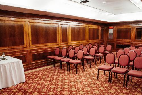 a room with a bunch of chairs and a table at Grand Hotel Continental Bucuresti in Bucharest