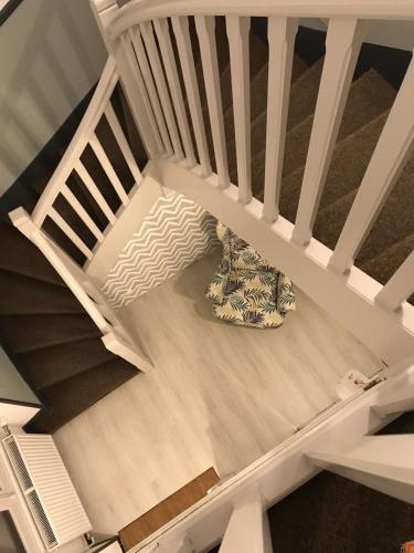an overhead view of a stairs with a pillow at Le Tronçais in Saint-Bonnet-Tronçais