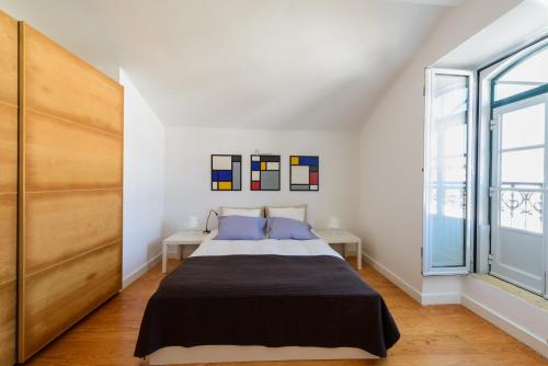 Ένα ή περισσότερα κρεβάτια σε δωμάτιο στο Timeless apartment at the heart of the village II