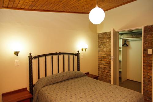 a bedroom with a bed in a room at Swadini, A Forever Resort in Hoedspruit