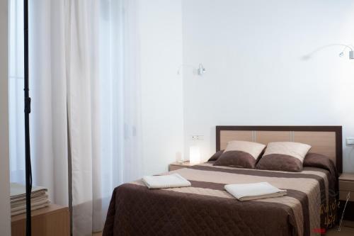 Кровать или кровати в номере Apartamento Quixote Loft Almagro