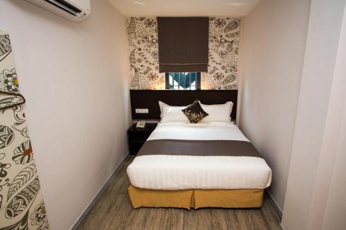 A bed or beds in a room at Double M Hotel @ Kl Sentral