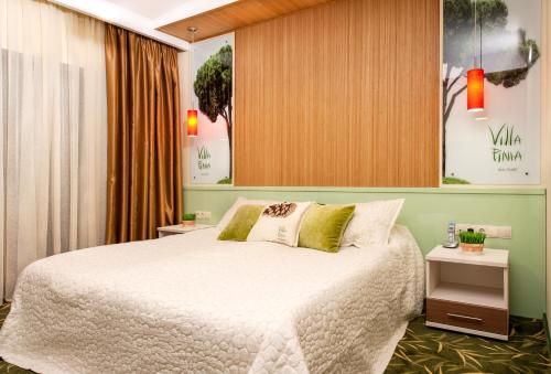 Postel nebo postele na pokoji v ubytování Villa Pinia Eco-hotel