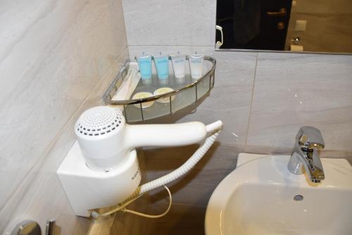 a bathroom with a toilet and a sink at SaBa Apartments in Old Tbilisi in Tbilisi City