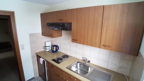 a small kitchen with a sink and a counter at Haus Christof in Holzgau