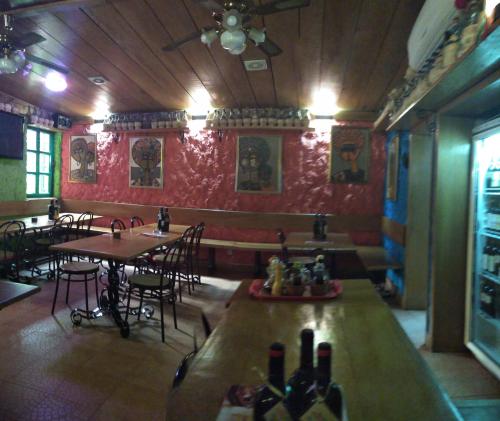 a restaurant with tables and chairs in a room at Manuela Residence in Lagos