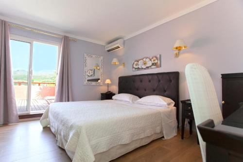 Postel nebo postele na pokoji v ubytování Hotel Macchia e Mare