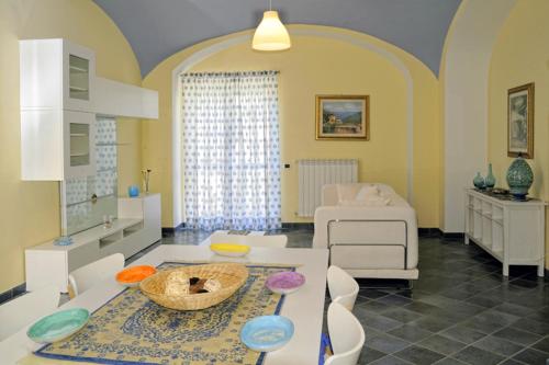 a living room with a table and a couch at Le terrazze di Cristina in Vietri