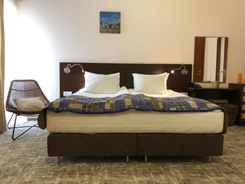 Ένα ή περισσότερα κρεβάτια σε δωμάτιο στο Altrimo Hotel