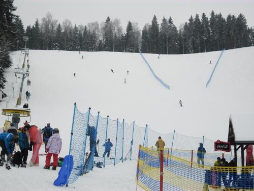 a group of people on a snow covered ski slope at Villa Meteor in Mariánské Lázně