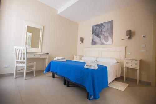 Postel nebo postele na pokoji v ubytování Hotel Grifo