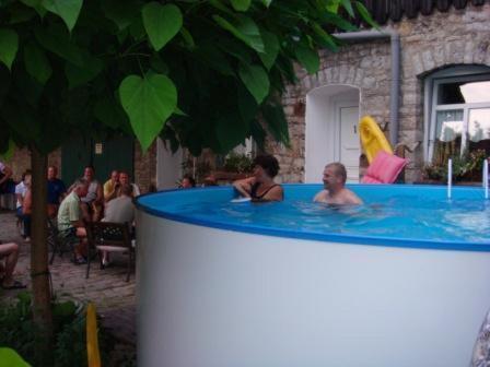 a man and a woman in a hot tub at Hotel Flower Power in Hehlen