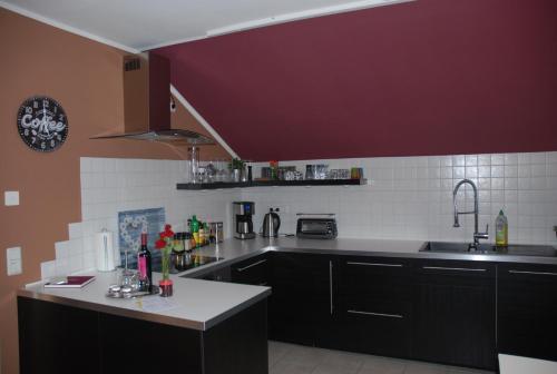a kitchen with a sink and a counter top at Ferienwohnung Blumäcker Oberbayern in Oberhausen