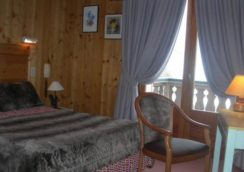 מיטה או מיטות בחדר ב-Le Cordonant