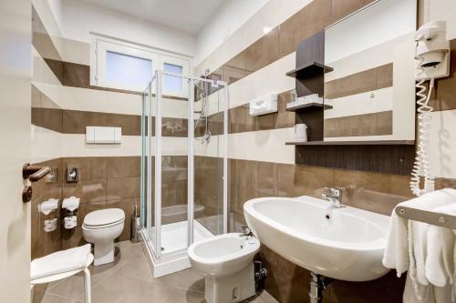 a bathroom with a sink and a toilet and a shower at Villa Maria Hotel & SPA in Francavilla al Mare