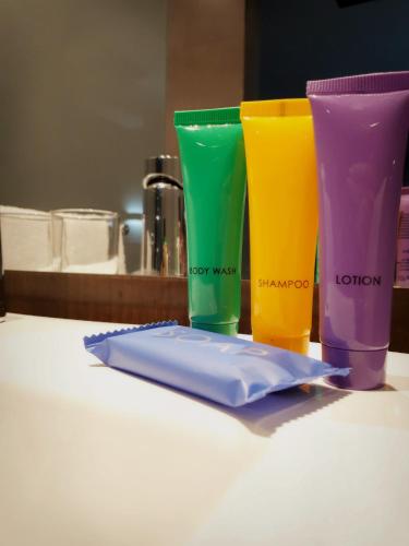 four different colored cups sitting on a table at Palm Swift Luxury Accommodation in Brits