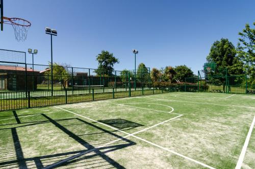 a tennis court with a net on top of it at Pazo de Eidian in Eidián