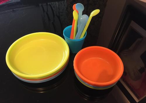 three colorful bowls sitting on a table with toothbrushes at CK Serviced Apartments Belfast in Belfast