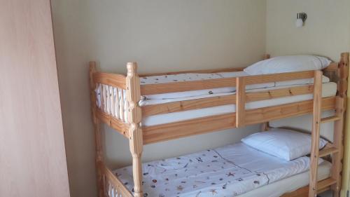 a couple of bunk beds in a room at de Zandput 46 in Zoutelande