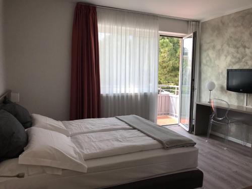 Postel nebo postele na pokoji v ubytování Hotel Piccolo Mondo