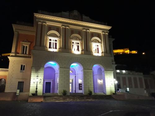 a building with purple and blue lights on it at Casa Cenzina in Cosenza