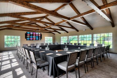 a large conference room with a long table and chairs at The Inn at Pasatiempo in Santa Cruz