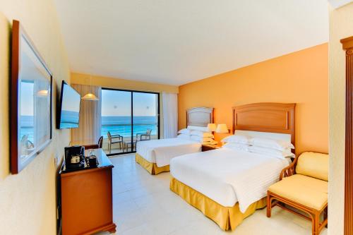Кровать или кровати в номере Occidental Tucancún - All Inclusive