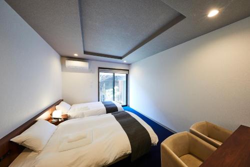 Cama o camas de una habitación en Rinn Kiyomizu Gojo