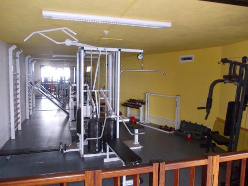 a room with a gym with several tread machines at Hotel La Palma Romántica in Barlovento