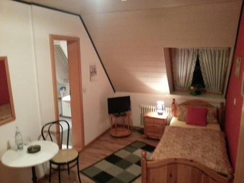 Postel nebo postele na pokoji v ubytování Gasthof Altes Farmhaus und Apartment