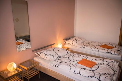 Postel nebo postele na pokoji v ubytování Městské kulturní centrum ve Fulneku