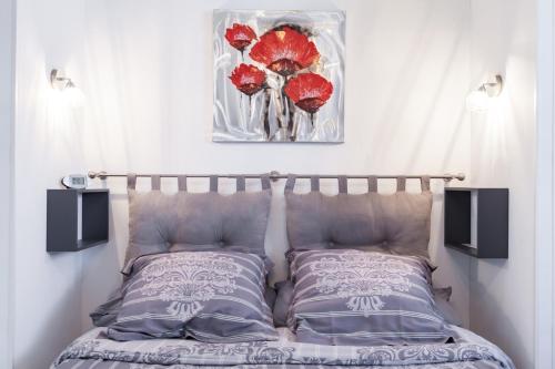 A bed or beds in a room at Joli gîte proche Strasbourg