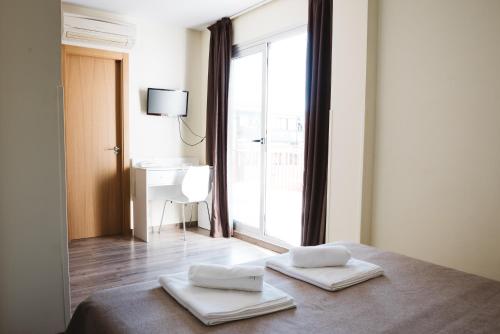Postel nebo postele na pokoji v ubytování Hotel Celymar
