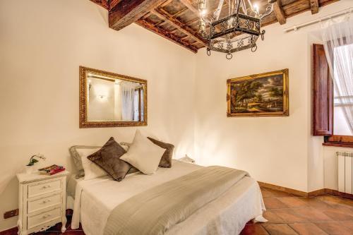 Postel nebo postele na pokoji v ubytování FRESH HOUSE TREVI 1